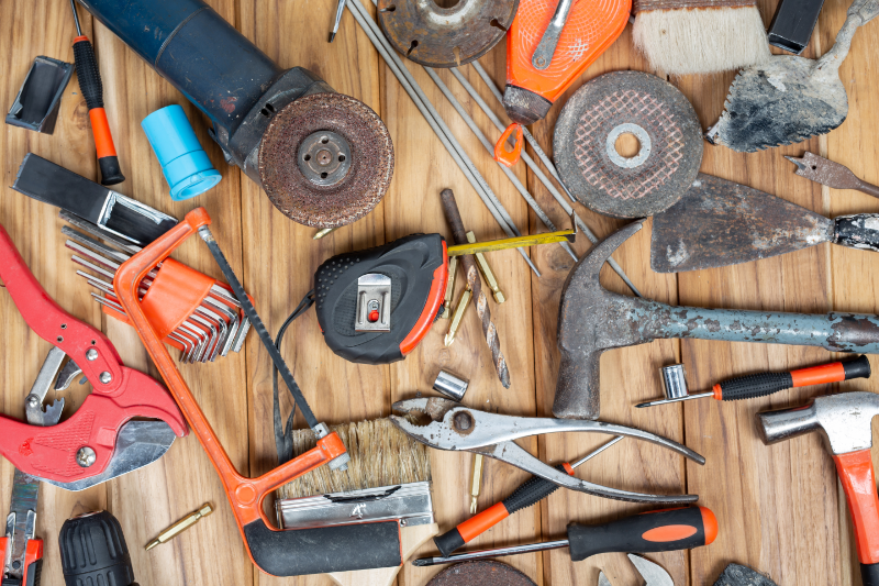 The image shows essential masonry tools required for home maintainance